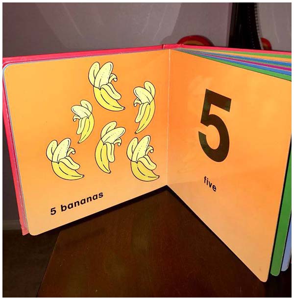 A page spread from a children's counting book. The text reads
